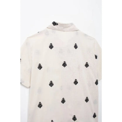 Conjunto Elegance: casual com 2 peças bordados com camisa tipo top de manga curta e lapela combinando calças largas