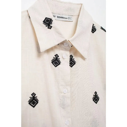 Conjunto Elegance: casual com 2 peças bordados com camisa tipo top de manga curta e lapela combinando calças largas