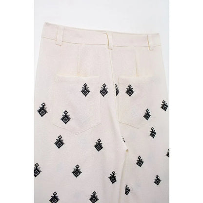 Conjunto Elegance: casual com 2 peças bordados com camisa tipo top de manga curta e lapela combinando calças largas