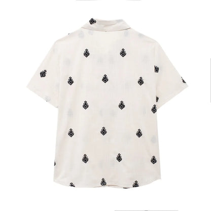 Conjunto Elegance: casual com 2 peças bordados com camisa tipo top de manga curta e lapela combinando calças largas