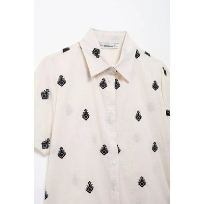 Conjunto Elegance: casual com 2 peças bordados com camisa tipo top de manga curta e lapela combinando calças largas